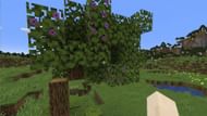 A flowering azalea tree indicated by the purple flowers (Image via Mojang)